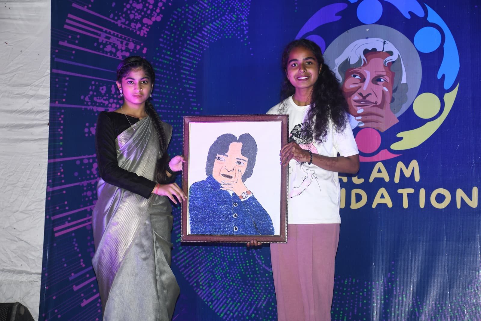 Young artist presenting a portrait